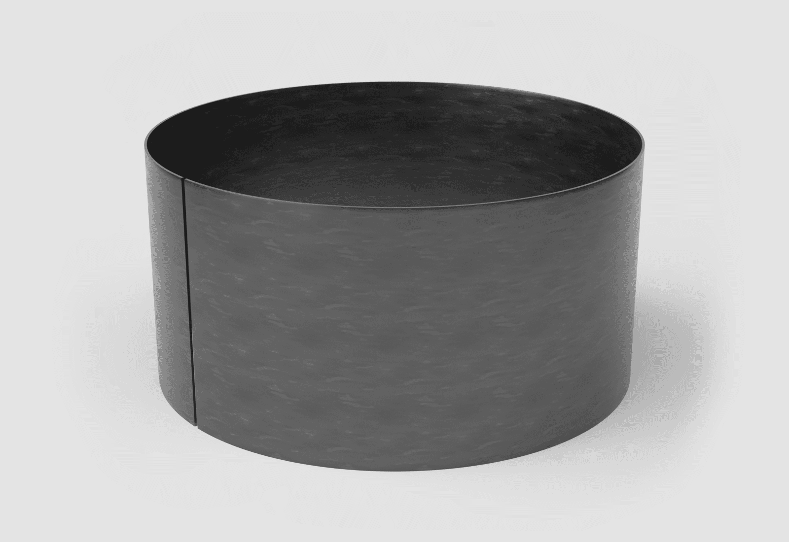 Steel plate rolled into a large cylinder shell, standing on end with its seam still open